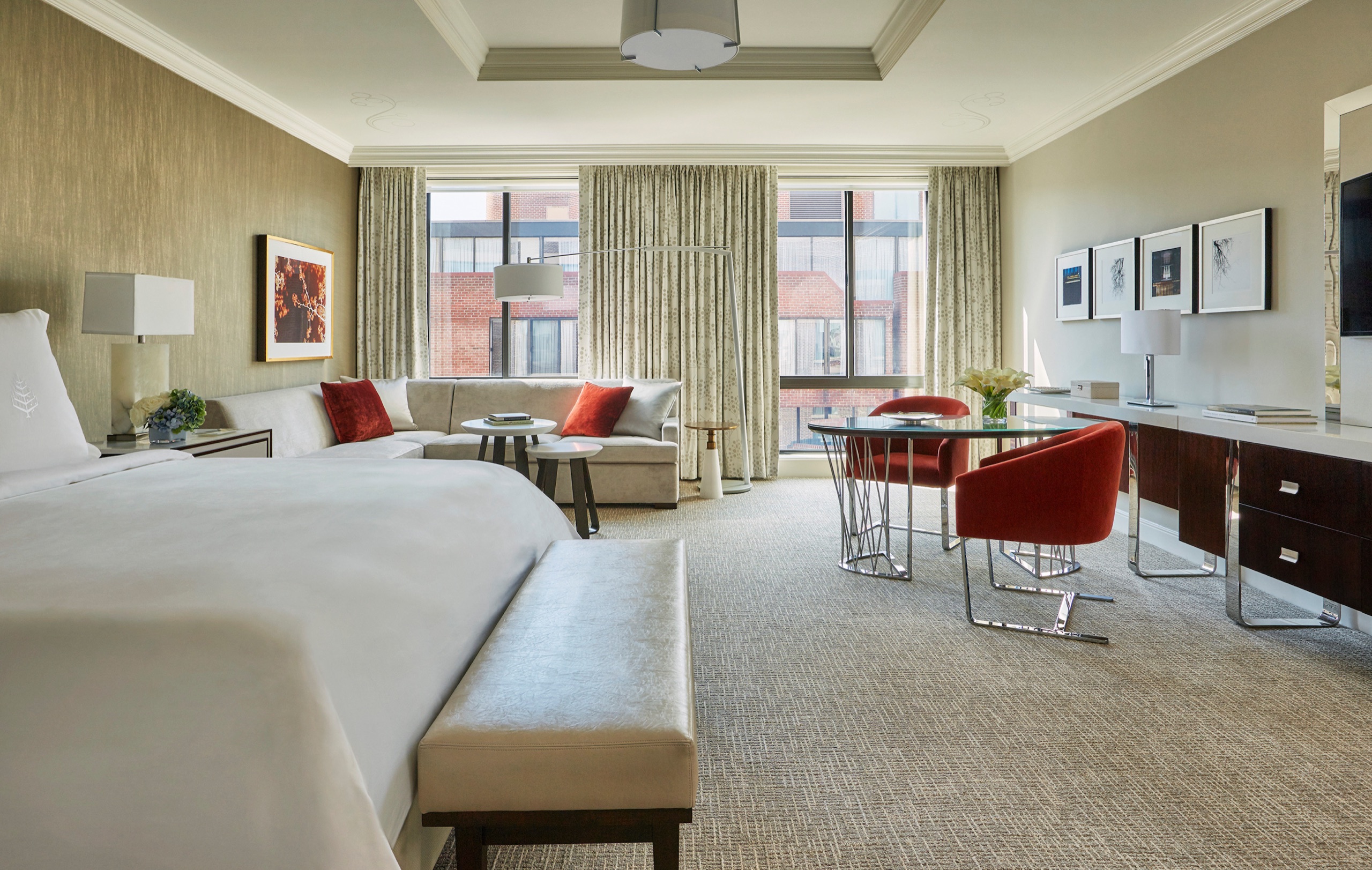Grand Premier Room - bed, work desk and corner windows over Georgetown