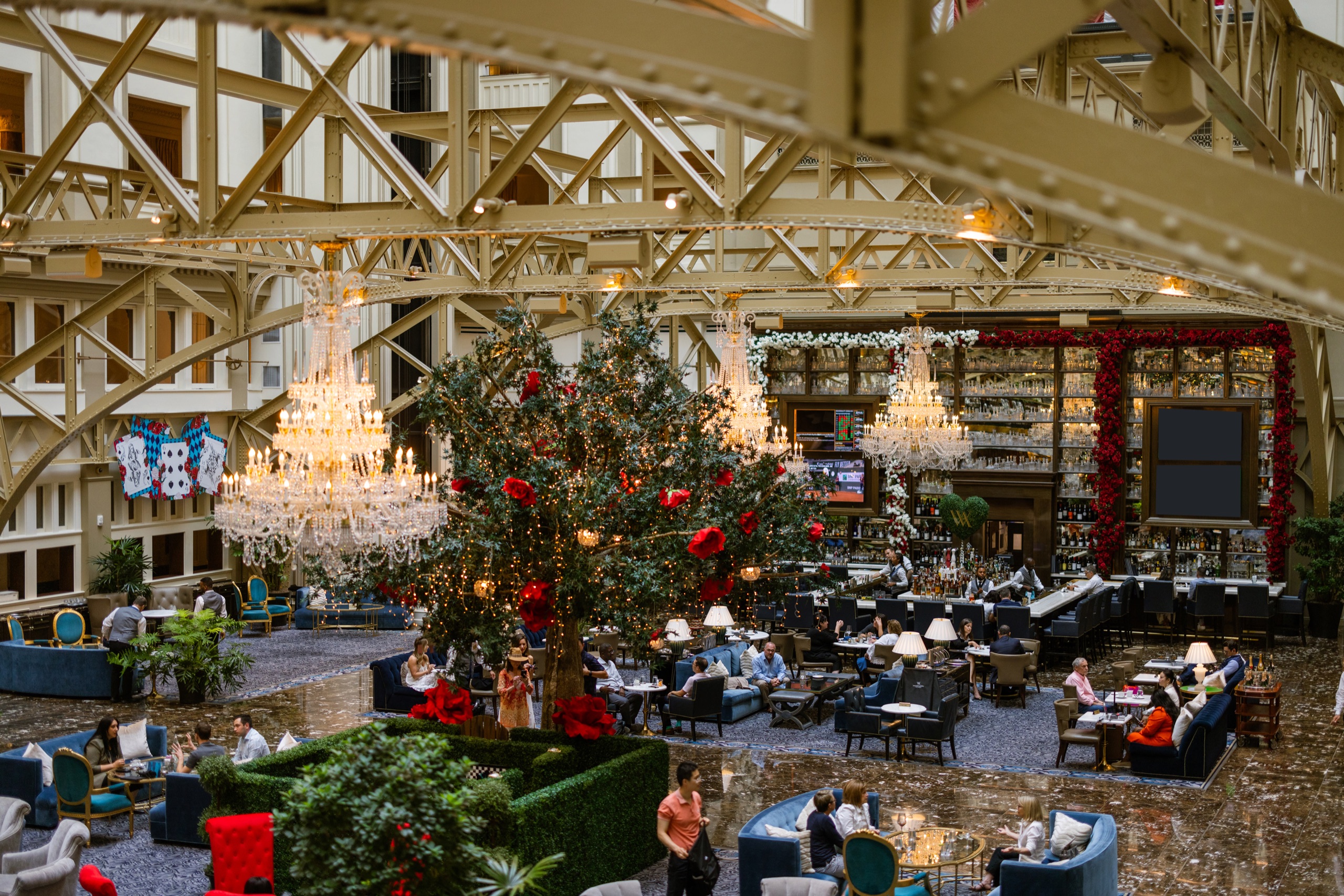 Peacock Alley dining and lounge in the atrium with guests