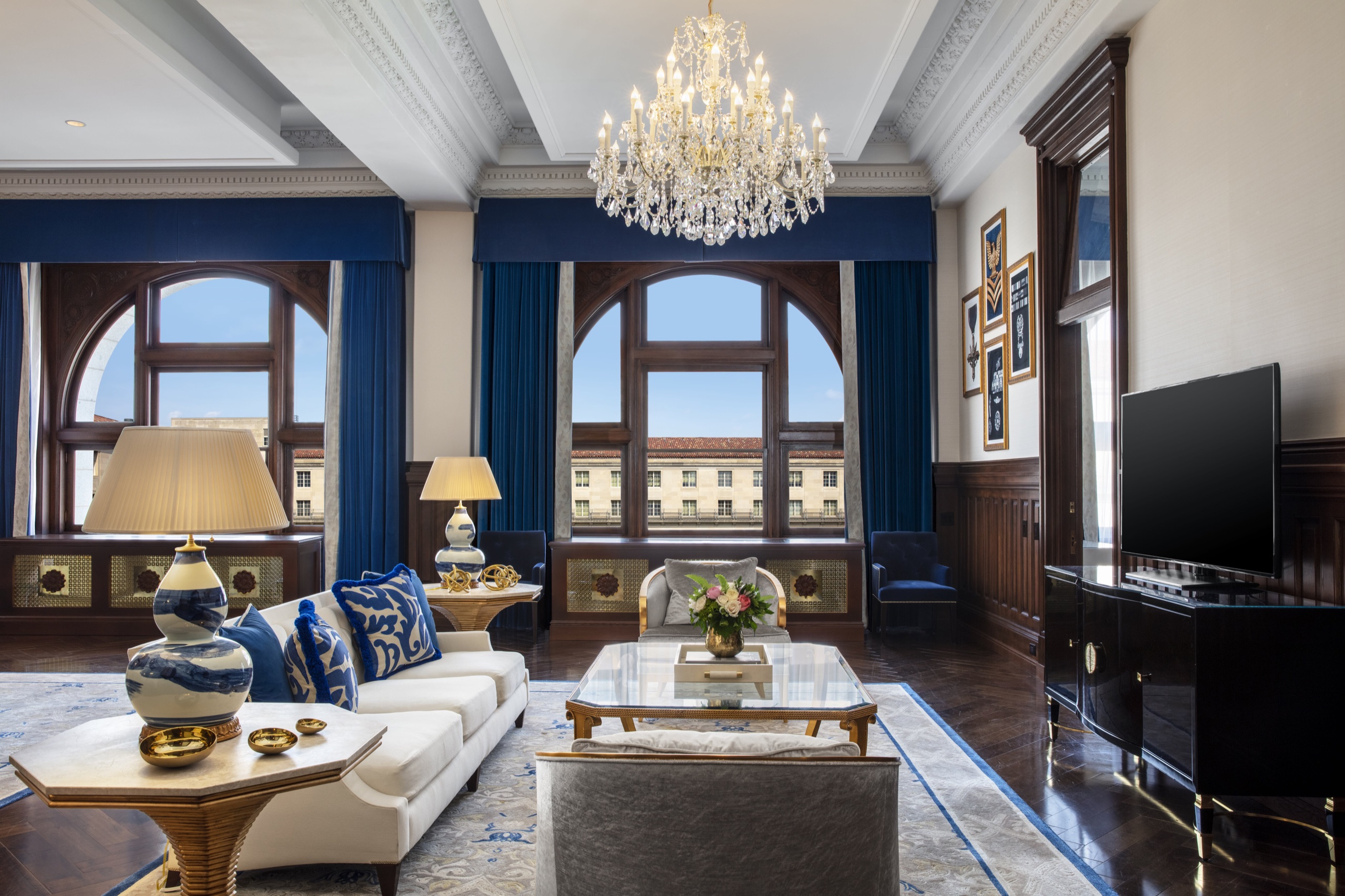 Presidential Suite living room with arched windows over Pennsylvania Avenue